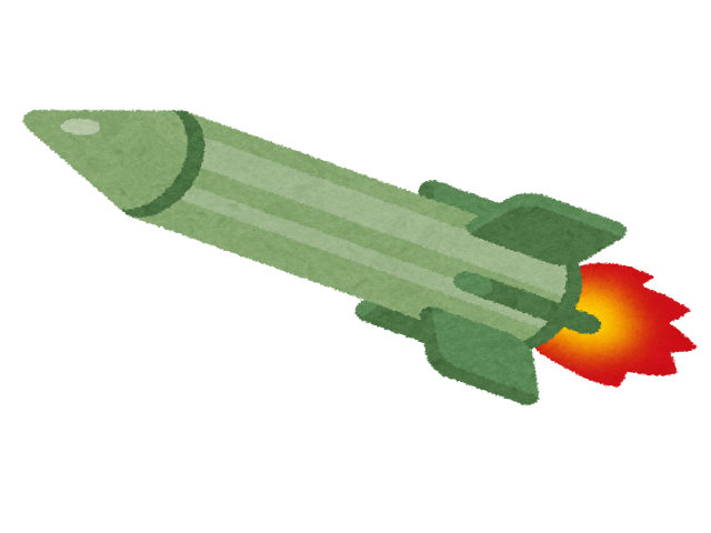火を噴きながら飛んでいる緑色のミサイル